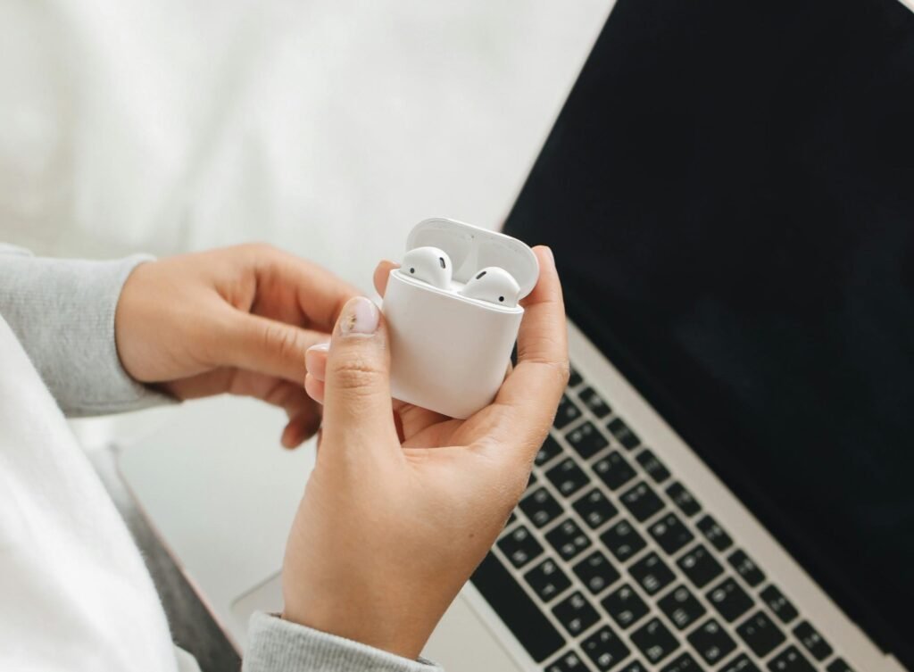 How do you check the status of your charge on your AirPod case